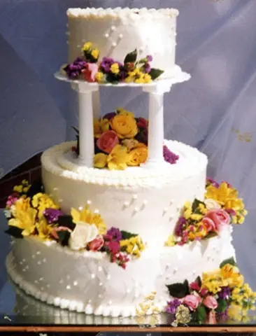 Decorated wedding cake with fresh flowers